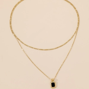 Double-layered gold titanium steel necklace with a sleek black rectangular pendant
