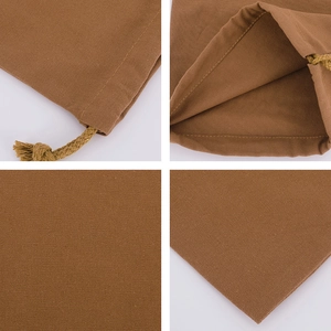 Detail view of brown cotton canvas drawstring bag showing fabric texture and seams