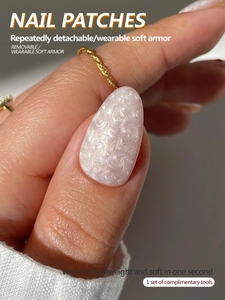 Macro detail of oval pearlescent marble nail patches with glittering crystal finish