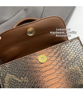 Close-up of vintage brown snakeskin texture and high-quality gold magnetic buckle