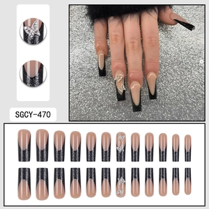 Long trapezoid French press-on nails with black glitter tips and silver butterfly rhinestones