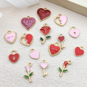 Macro shot of assorted red and pink enamel heart and flower DIY jewelry charms