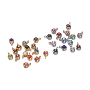 Macro detail of multicolored zircon pendants in gold and silver settings for DIY jewelry