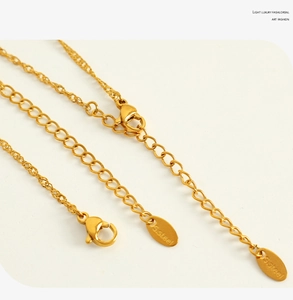 Close-up of 18K gold plated stainless steel lobster clasp and delicate chain link