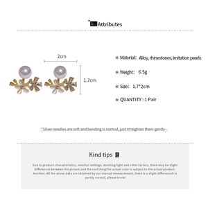 Detailed size specifications and material view of floral faux opal pearl stud earrings