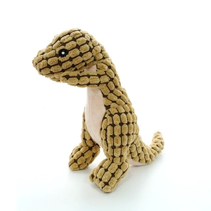 Close-up of brown corn plush dinosaur toy showing durable nubby texture and fabric detail