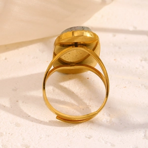 18K gold plated stainless steel open ring with oval grey stone on a white background