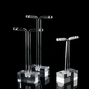 Three transparent acrylic T-bar earring display stands in various heights with rectangular bases