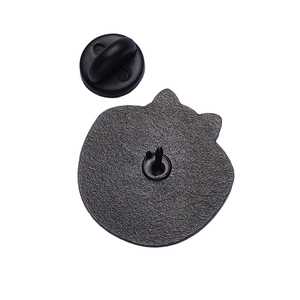 Rear view of enamel cat pin showing black matte texture and rubber butterfly clutch back