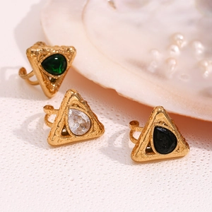 Detail of 18K gold-plated teardrop gemstone rings featuring green, white, and black stones