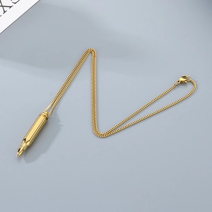 Detailed view of polished golden bullet pendant necklace with high-gloss metallic finish