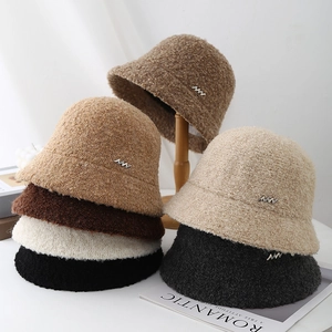 Chic curly fleece bucket hats in various colors with metal logo for autumn and winter wear