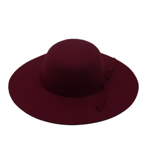 Detail view of burgundy wool felt wide brim fedora hat with matching ribbon bow decoration