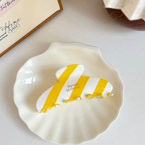 French style hair claw clip featuring yellow and white striped acetate with polished finish