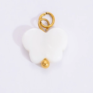 Detailed view of white butterfly pendant with 18k gold accents and double ring clasp