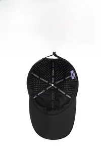 Close-up of lightweight mesh ventilation holes on a quick-dry black baseball cap