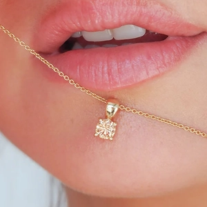 Close-up of gold S925 silver necklace with champagne gemstone pendant on neck