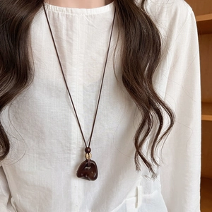 Minimalist geometric wood resin pendant necklace with dark brown finish and gold bead