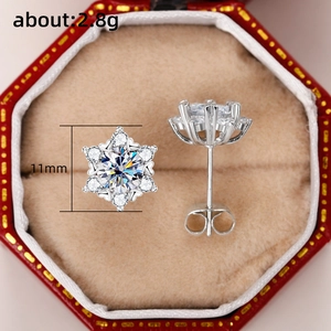Detail view of snowflake stud earrings showing 11mm size and 2.8g weight specs