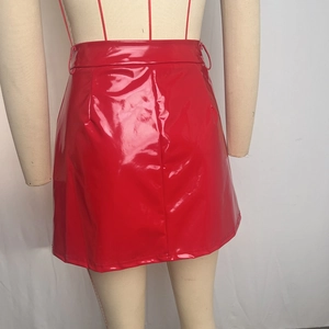 Detailed back view of red patent leather mini skirt on a mannequin with glossy finish