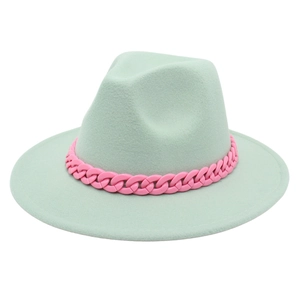 Detail of mint green fedora wool hat featuring a bold pink acrylic chain decoration