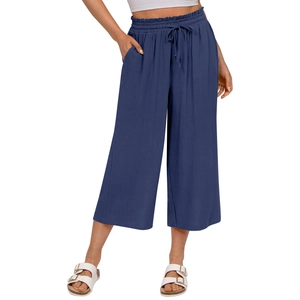 Detail of high waisted navy linen trousers with adjustable drawstring and side pockets