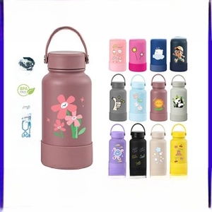 Detail view of 30oz stainless steel tumblers showing various colors and floral patterns
