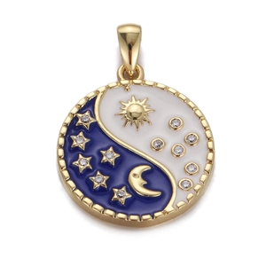 Macro shot of Yin Yang pendant with gold moon, sun, and crystal enamel details