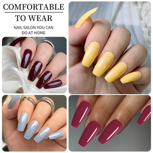 Short square matte fake nails in burgundy, yellow, blue, and purple matte colors