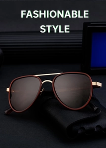 Macro shot of aviator polarized sunglasses on a black leather case with gold accents