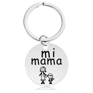 Macro detail of silver stainless steel keychain with mi mama engraving and mother-child icon