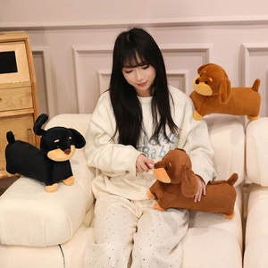 Soft dachshund plush toys in three colors displayed with a model on a sofa