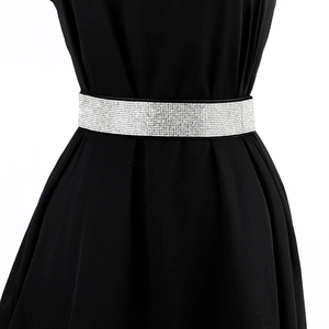 Close-up of a wide elastic waist belt for women with sparkling silver rhinestones