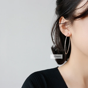 Minimalist S925 sterling silver hoop earrings for women, 50mm diameter worn on model