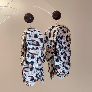 Detailed view of leopard print chiffon leaf tassel earrings with brown round studs