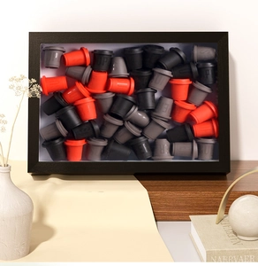 Detailed view of deep 3cm black wooden shadow box frame filled with miniature coffee cups