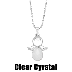 Macro detail of silver angel pendant featuring a teardrop-shaped clear crystal and wings
