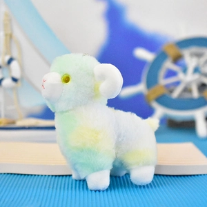 Detailed side view of a cute pastel tie-dye plush sheep keychain in a nautical theme