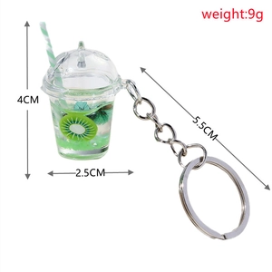 Detailed view of creative kiwi fruit tea keychain with resin cup and metal ring measurements