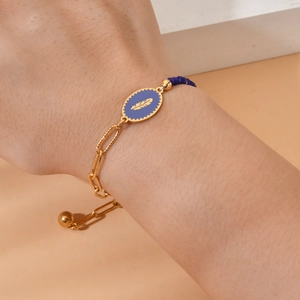 Golden feather enamel bead bracelet for women featuring blue crystal charms and drawstring