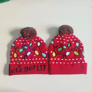 Close-up of LED Christmas beanie with Let's get LIT text and colorful glowing lights