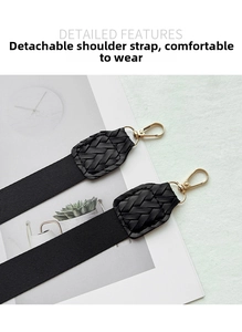 Close-up of detachable black woven shoulder straps with gold-tone metal lobster clasps