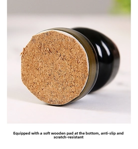 Detail of ceramic ashtray base with cork pad for anti-slip and scratch protection