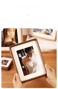 Close-up of a premium black walnut photo frame featuring rounded corners and joint details
