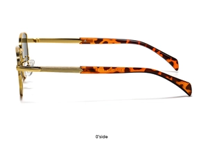 Detail shot of vintage gold metal frame sunglasses with tortoiseshell temples from side view