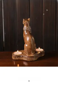 Detailed close-up of Egyptian Bastet cat candle holder with engraved hieroglyphics