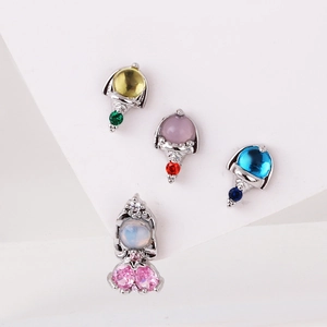 Detail of 4-piece 925 silver stud earrings set with colorful micro-pave geometric zircons