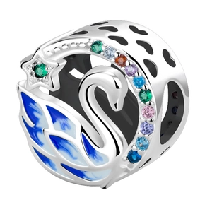Detail of a blue enamel swan charm with colorful zircon stones and star elements