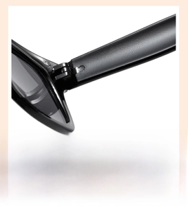 Detail view of durable metal hinges on children's black fashion sunglasses for smooth opening