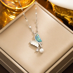 Elegant asymmetrical butterfly pearl necklace with blue enamel and crystal in a gift box